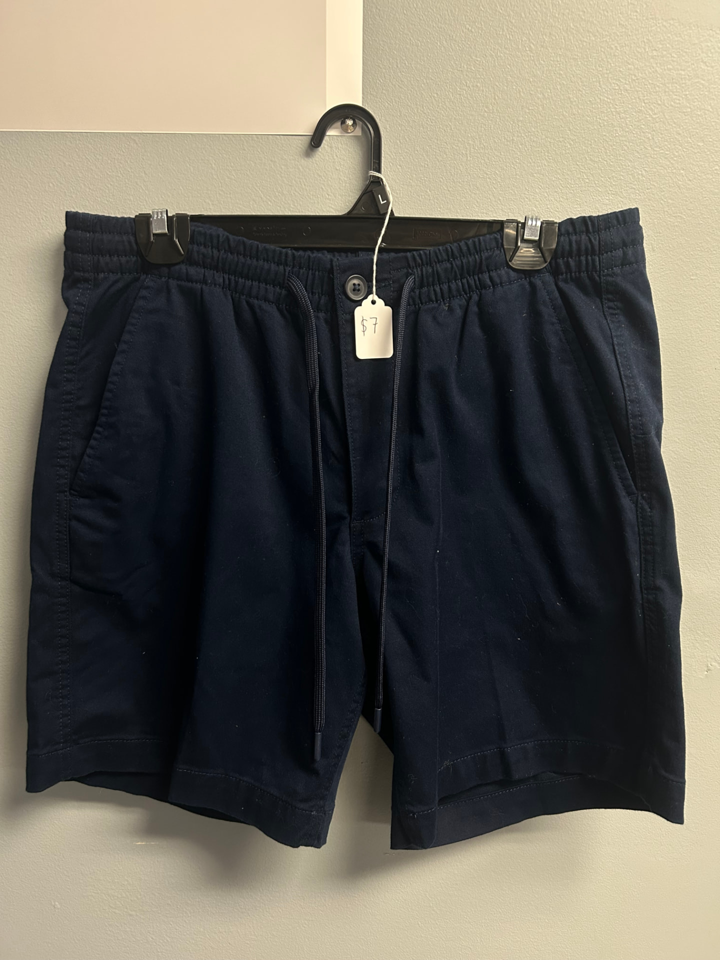 Navy blue shorts with elastic waistband and drawstring