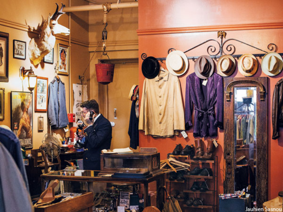 Vintage clothing and accessories displayed inside a curated thrift shop