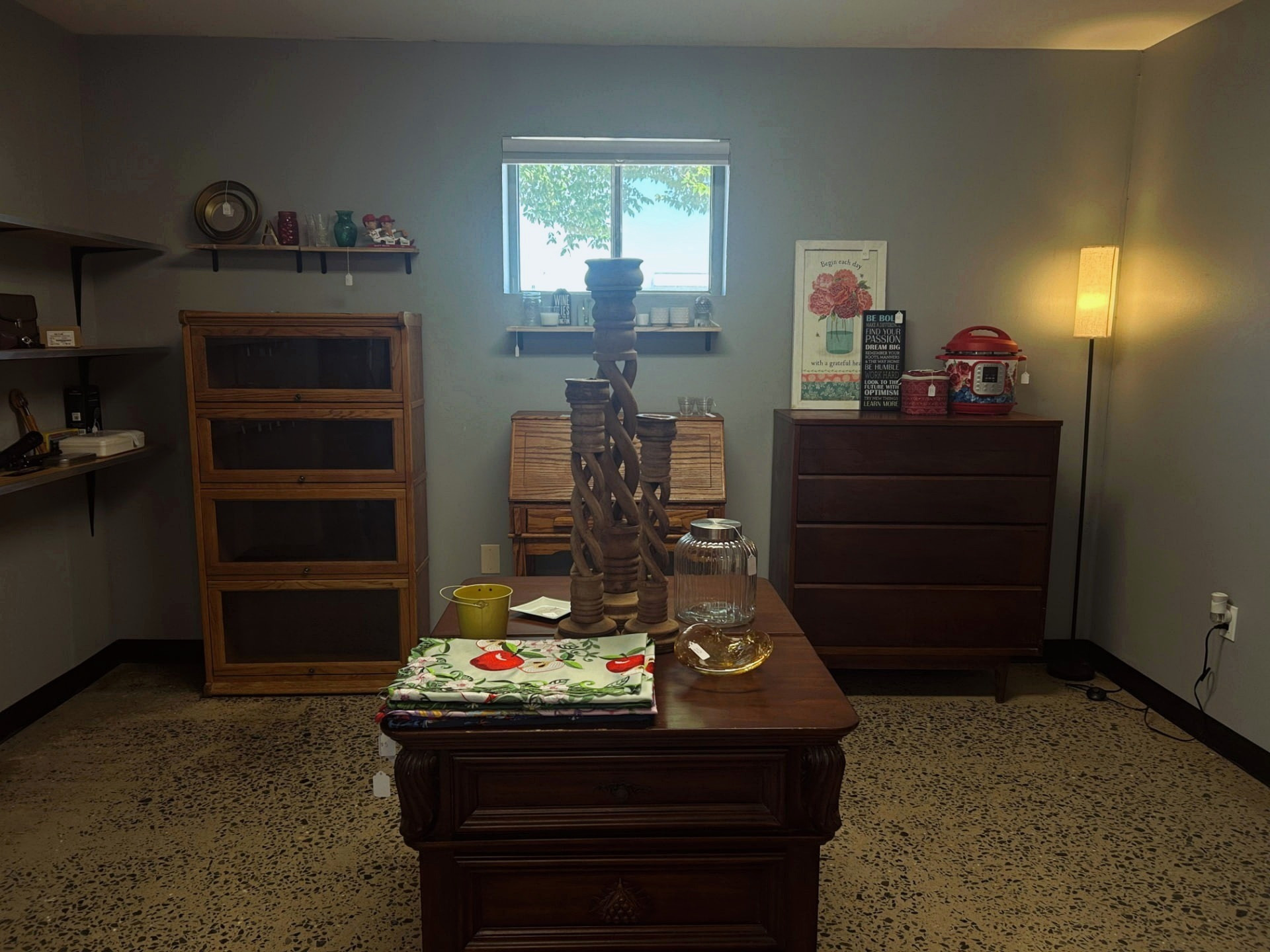 Vintage wooden furniture and home décor displayed inside Ozark Vintage Thrift Works