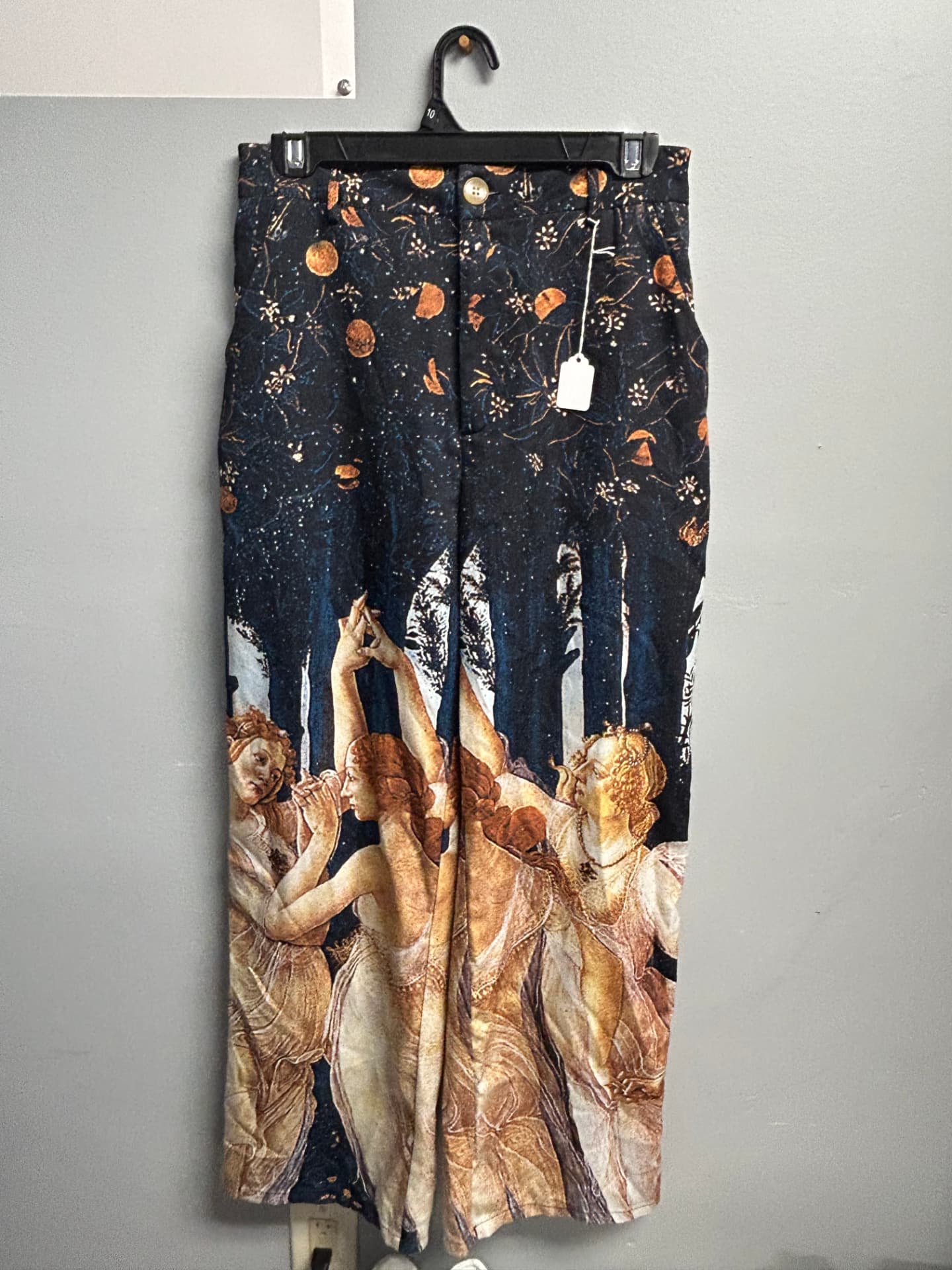 Wide-leg trousers printed with a classical art scene